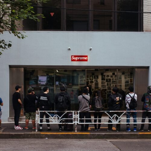 people in line in front of Supreme store